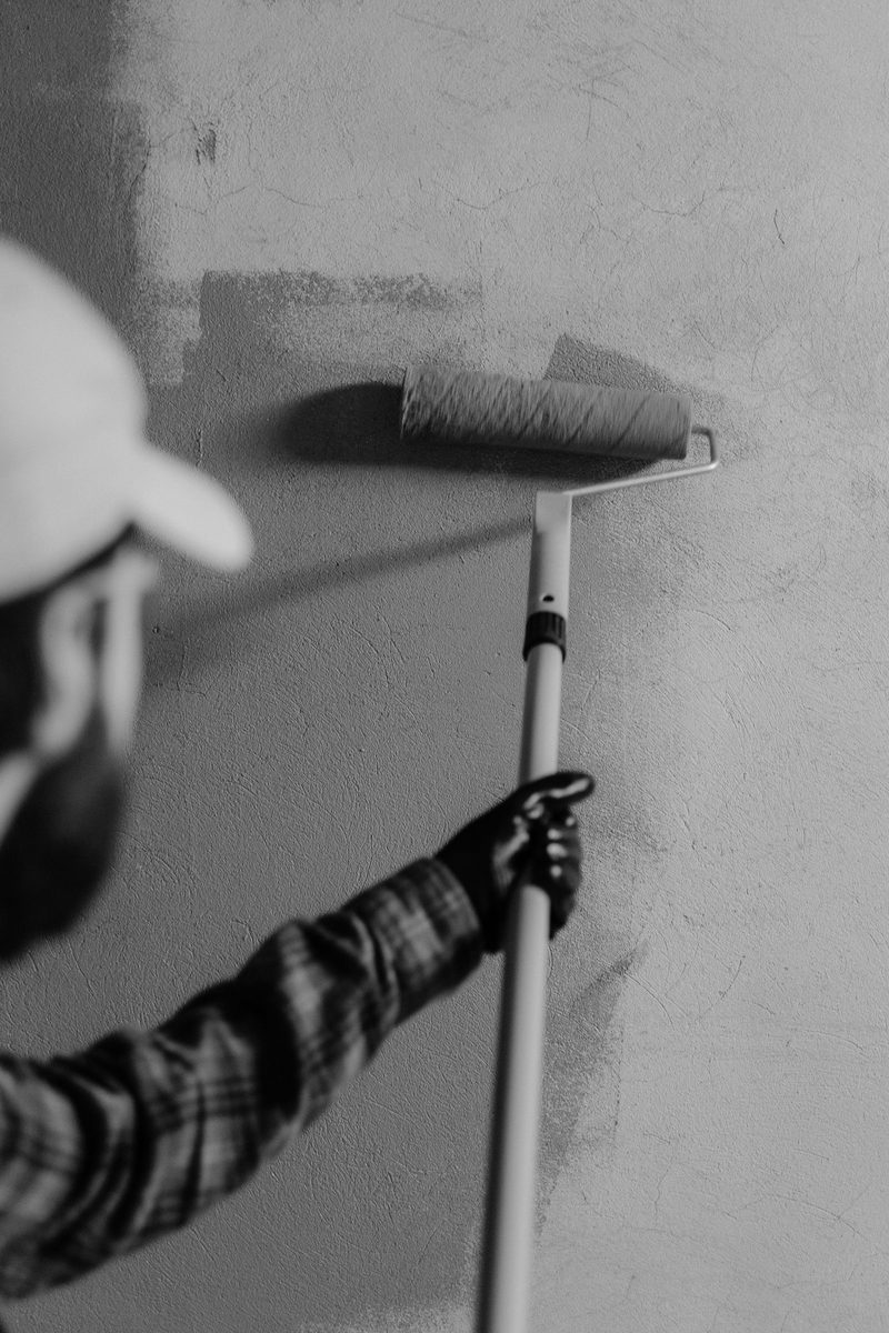 Close-up of a painter with a roller